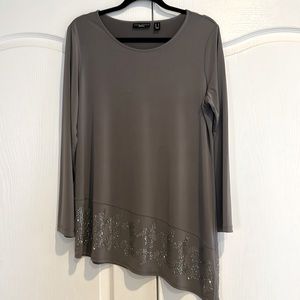 Dressy angled long sleeve top.